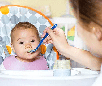 Baby being fed