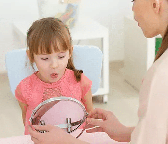 Girl in speech therapy